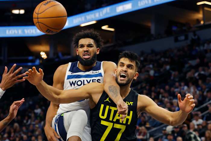 Nov 30, 2023; Minneapolis, Minnesota, USA; Minnesota Timberwolves forward Karl-Anthony Towns (32) and Utah Jazz center Omer Yurtseven (77) watch a loose ball go in the third quarter at Target Center.